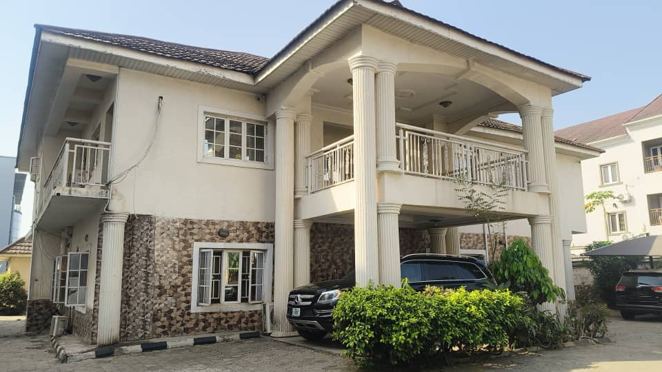 Front view of a two-storey Abuja house with balconies